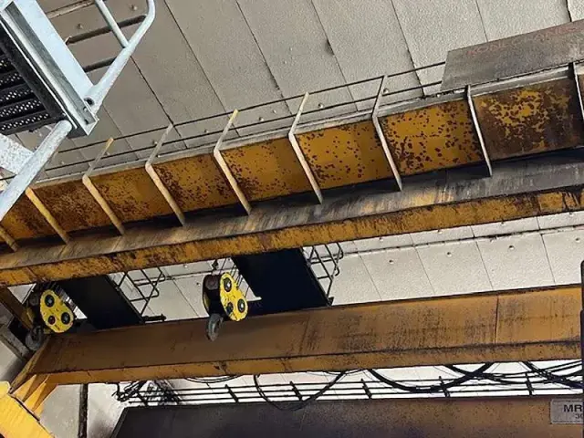 Rusted overhead crane before corrosion treatment
