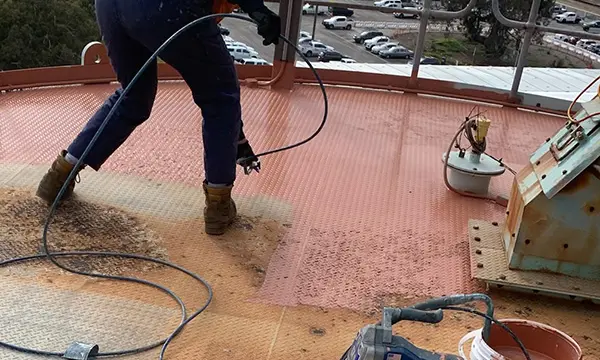 NanoPrep being applied to silo roof by spray